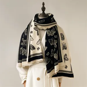 Thick cashmere scarf with black and white butterfly pattern and fringe tassels