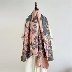 Elegant floral cashmere shawl with fringe trim in soft pink and charcoal grey tones