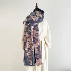 Denim blue floral cashmere shawl with pink flower pattern and delicate fringe trim