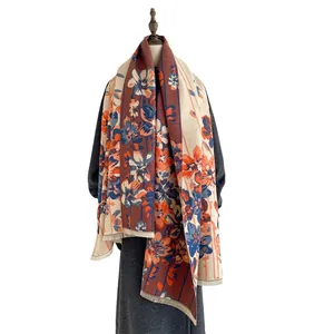 Retro abstract floral cashmere-feel shawl with tassel fringe displayed on a mannequin