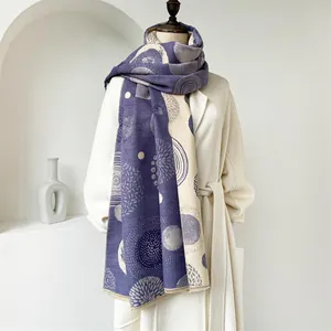 Detail of bohemian geometric scarf in purple and beige draped on a wool coat
