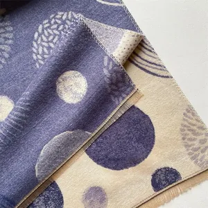 Close-up of Bohemian pashmina scarf detailing purple circle patterns and fringe edges