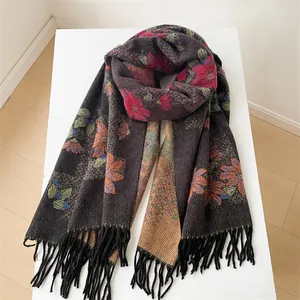 Close-up of floral cashmere scarf with colorful flower patterns and black tassels
