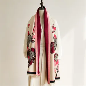 Detail of winter thick scarf with lotus pattern jacquard and delicate fringe trim