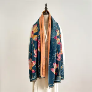 Detail of oil painting style scarf with pink lotus print and orange tassel edges