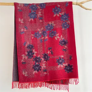 Floral cashmere-feel winter scarf in vibrant red with blue flower prints and tassels