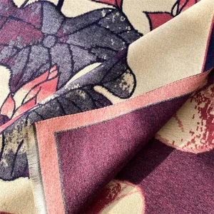 Detailed macro of vintage lotus jacquard shawl featuring floral patterns and soft tassels