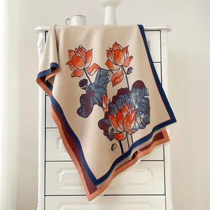 Detailed view of winter lotus pattern scarf with elegant fringe edges and woven texture