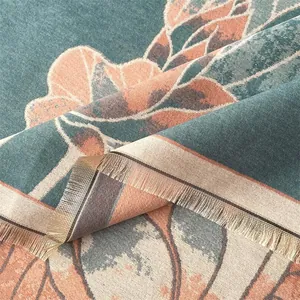 Macro shot of ethnic lotus pattern jacquard fabric with elegant fringes and thick texture