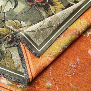 Close-up of double-sided jacquard floral scarf showing fringe detail and thick woven texture
