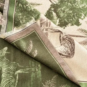 Close-up of the double-sided jacquard texture and zebra forest pattern of this soft scarf