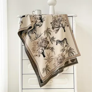 Close-up of zebra pattern cashmere scarf showing delicate fringes and soft texture
