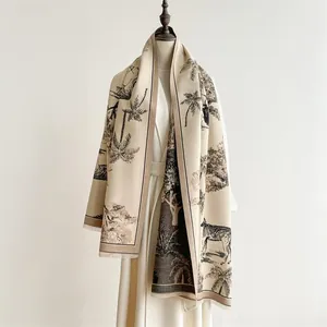 Detail of pashmina scarf with tropical zebra and palm tree prints and soft fringes