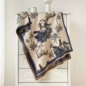 Detail of soft winter shawl featuring vintage zebra and jungle patterns with tassels