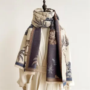 Detail of pashmina scarf featuring realistic tiger and palm tree motifs with soft fringe edges