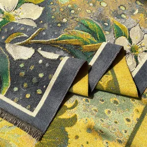 Macro shot of thick oil painting style woven scarf featuring floral patterns and tassels