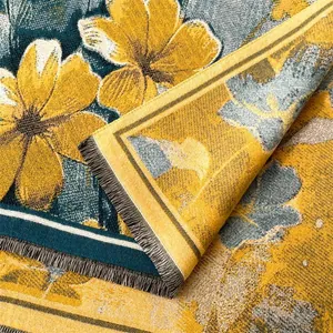 Close-up of high-density woven floral tapestry with yellow flowers and black fringe details