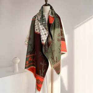 Detail of vintage ethnic cashmere-feel scarf with bamboo patterns and fringe edges