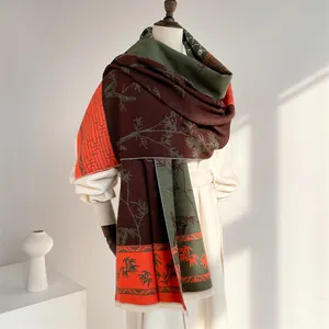Detail of vintage ethnic style scarf featuring bamboo patterns and fringed edges