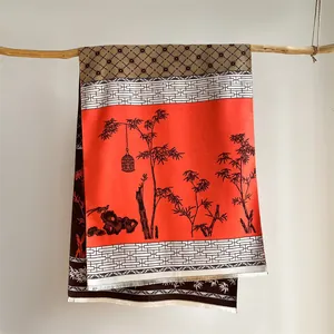 Detailed view of vintage ethnic scarf with bamboo prints and fine fringe tassels