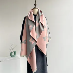 Dual-color pink and gray bow print scarf with frayed edges and logo detail
