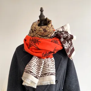 Detail of vintage ethnic scarf with bamboo prints and soft fringe on a mannequin