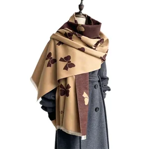 Women's bow jacquard faux cashmere scarf in earth tones with stylish tassels
