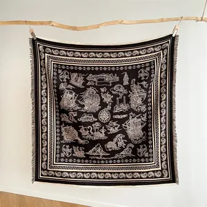 Detail of nautical tapestry with sailboat and sea monster patterns on soft knit fabric