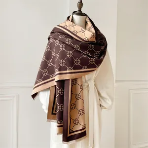 Detail of classic clover pattern shawl with fringe edges and dual-tone woven texture