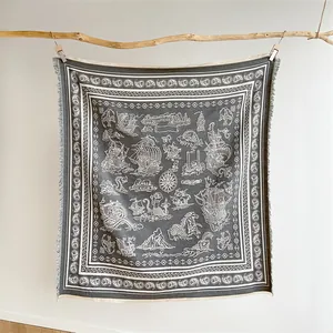 Detail of nautical tapestry featuring sailing ships, sea monsters and rustic tassels