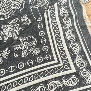 Close-up of thick paisley paisley shawl with jacquard patterns and tassel details