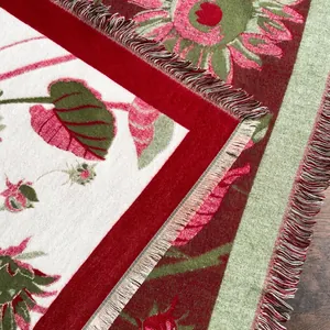 Detail of sunflower thick scarf with strawberry patterns and multi-color fringe edges