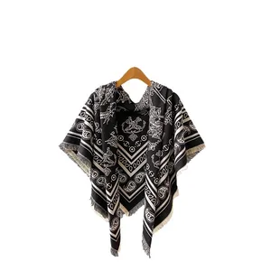Elegant black and white Paisley shawl poncho with bohemian tassels and soft cashmere-like fabric