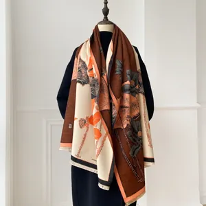 Close-up of winter cashmere-like shawl with lotus flower painting and fringe detail