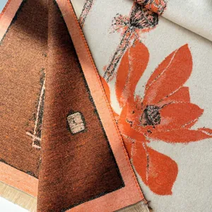 Detail of elegant winter scarf showing thick twill texture and classic floral patterns