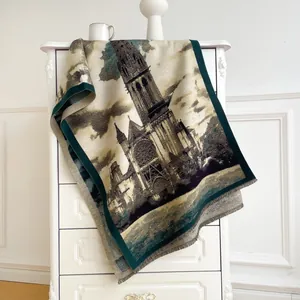 Detailed close-up of fringe edges and gothic cathedral pattern on a woven throw blanket