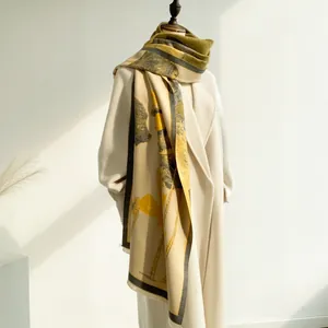 Close-up of winter cashmere shawl with floral patterns and delicate fringe details