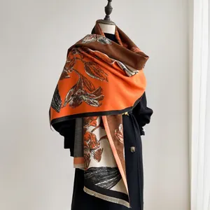 Close-up of artistic floral pattern and short fringe edge on thick cashmere-like shawl