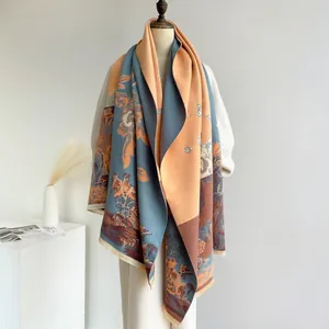 Detail of a large jacquard scarf with Chinese retro floral patterns and fringe edges