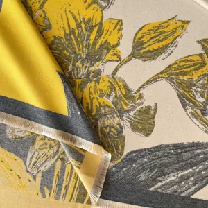 Detail view of retro floral thick cashmere-feel scarf with yellow pattern and soft tassels