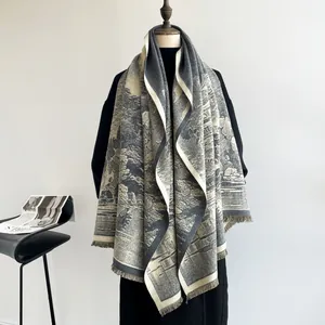 Detail view of vintage landscape print on thick cashmere-like shawl with fringe trim