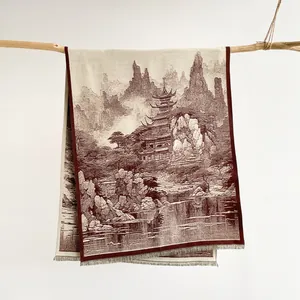 Detail of vintage Chinese landscape scarf with tassels hanging on a wooden branch