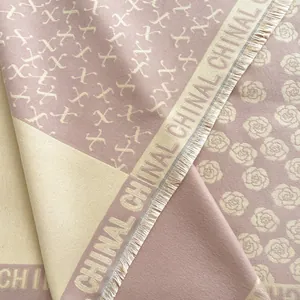 Detail of cashmere shawl showing camellia patterns, fringe edges and soft textures