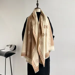 Detail of camellia jacquard scarf with contrast colors and elegant fringe edges