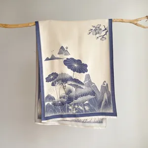 Detailed texture of jacquard scarf with blue lotus mountains and fine tassel edges