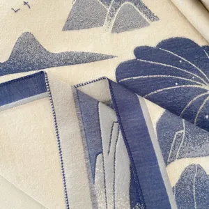 Close-up of thick jacquard weave showing mountain and lotus patterns on retro shawl
