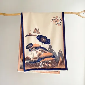 Detailed view of jacquard floral scarf with mountain patterns and fine tassels