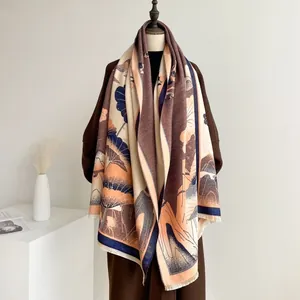 Close-up of retro floral patterns and tassels on a thick winter jacquard shawl