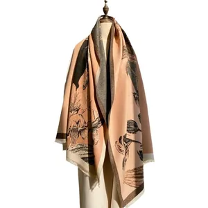 Thick cashmere-like shawl with vintage floral patterns and tassel edges in apricot pink