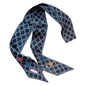 Elegant navy blue twilly scarf with chain pattern and equestrian symbols for bags
